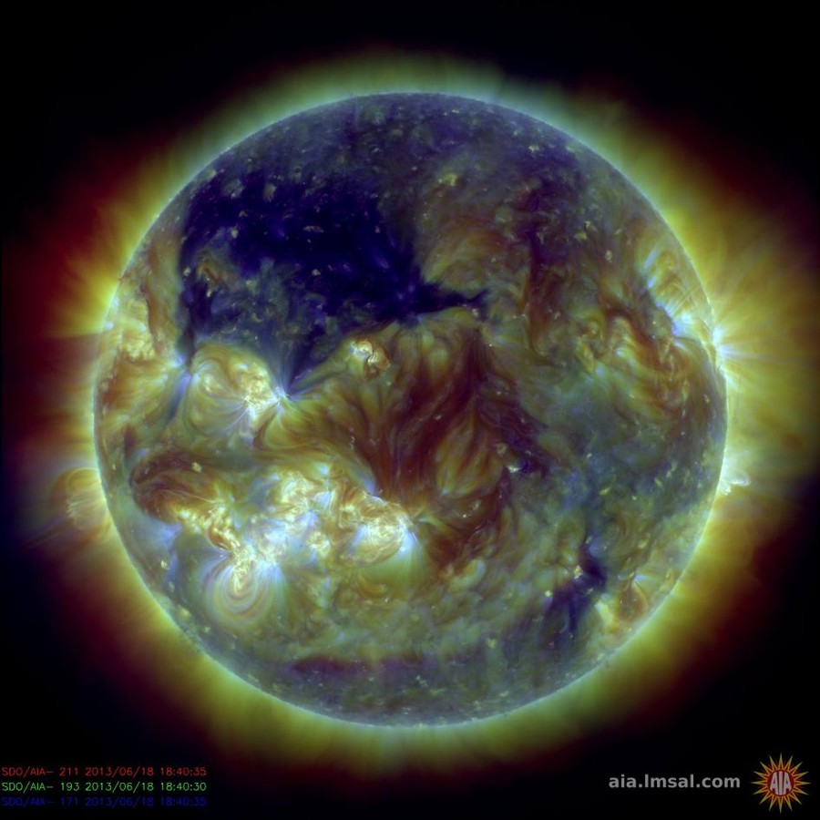© NASA's Solar Dynamics Observatory captured this picture of the sun on June 18, 2013, showing a huge coronal hole – seen here in dark blue 