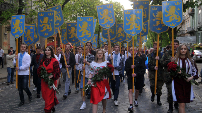 Ukrainian ultra-nationalists carry emblems of 14th SS-Volunteer Division "Galician" as they march in the center of the western city of Lviv on April 27, 2014 to mark the 71st anniversary of 14th SS-Volunteer Division "Galician" foundation.  (RIA Novosti)