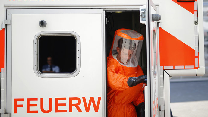 ebola-marshal-syringe-airport.si.jpg