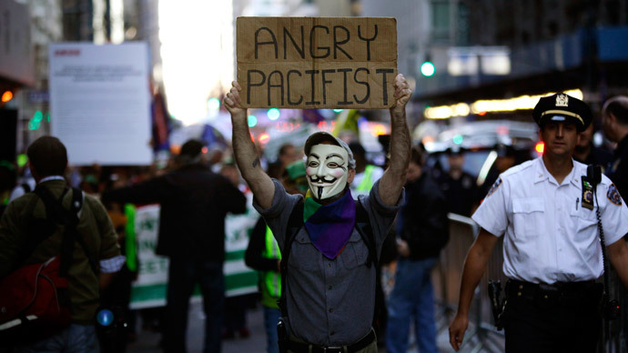 A Occupy Wall Street protester marches along Madison Avenue in New York.(Reuters / Joshua Lott)