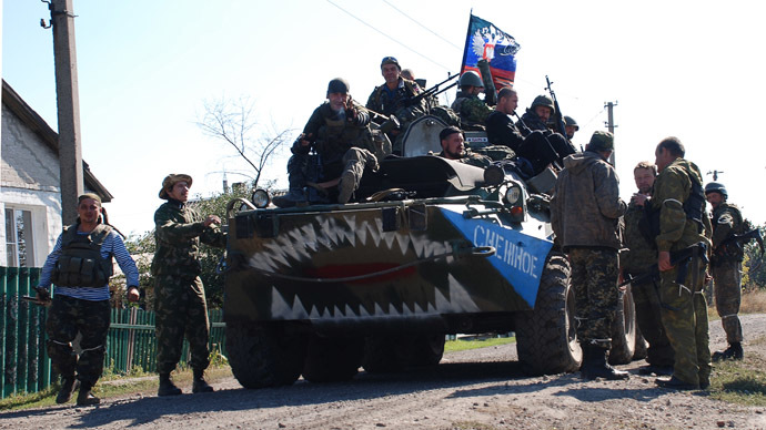 Fighters of the Donetsk People's Republic militia in the village of Yasenevka. (RIA Novosti/Gennady Dubovoy)