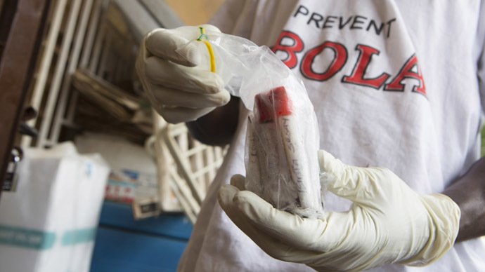 Blood samples from patients suspected of having the Ebola virus disease are prepared for transportation to Freetown for testing, at the Port Loko District Hospital September 27, 2014. (Reuters/Christopher Black)