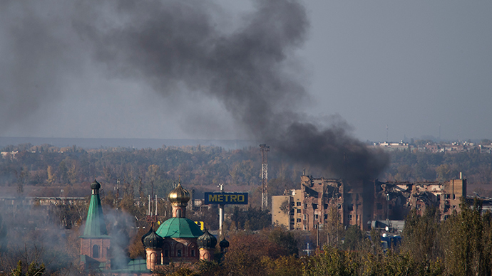 Smoke rises after shelling an area near the Donetsk Sergey Prokofiev International Airport in Donetsk, eastern Ukraine, October 12, 2014 (Reuters / Shamil Zhumatov)