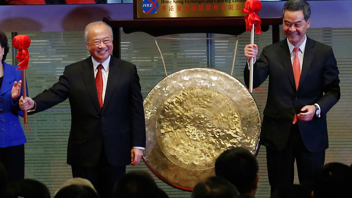 Hong Kong Exchanges and Clearing Ltd. Chairman Chow Chung-kong (L) and Hong Kong Chief Executive Leung Chun-ying smile after hitting a gong during the launch ceremony of the Shanghai-Hong Kong Stock Connect in Hong Kong November 17, 2014.(Reuters / Bobby Yip)