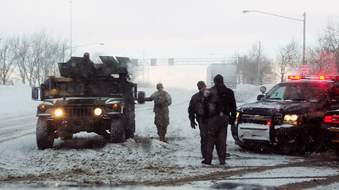 This US Army National Guard photo shows New York Army National Guard Soldiers from the 152nd Engineer Company as they use engineering equipment to assist in snow removal on November 20, 2014 efforts in Buffalo, New York. (AFP Photo/US Army National Guard/Senior Master Sgt. Ray Lloyd)