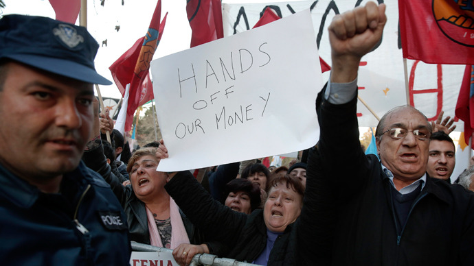 Protesters shout slogans during an anti-bailout rally outside the parliament in Nicosia March 19, 2013 (Reuters / Yorgos Karahalis)