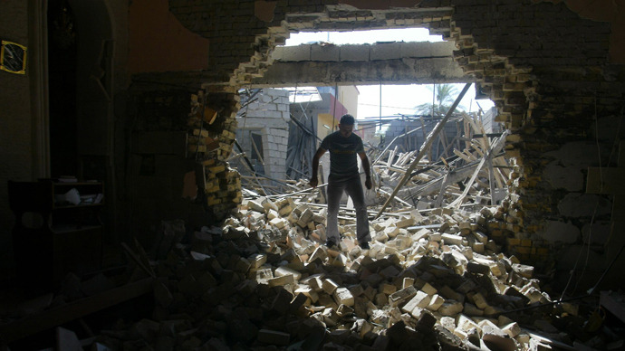 An Iraqi man inspects damages at the Mar Afram Syriac Orthodox Church following an explosion in the northern city of Kirkuk on August 15, 2011 as a series of nationwide attacks hit the country (AFP Photo / Marwan Ibrahim)