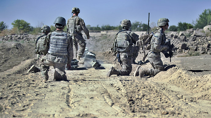 US Army troops from C-Company. 1st platoon, 1-23 infantry prepare to deploy 'A-pops' - charges fired by rocket onto surfaces suspected to have IED (improvised explosive devices) traps which explode and trigger the safe detonation of the devices at the village of Gerandai in Panjway district, Kandahar Province on September 21, 2012. (AFP Photo)