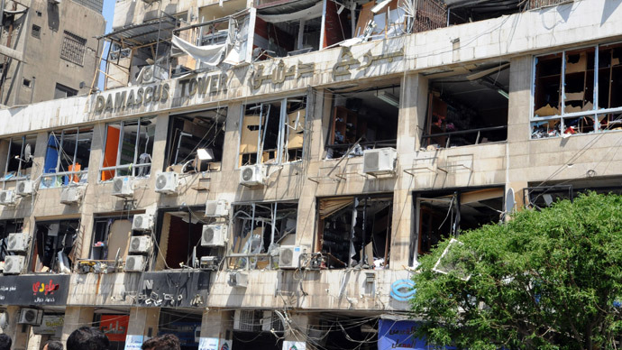 A handout picture released by the Syrian Arab News Agency (SANA) on April 30, 2013, shows the damaged frontage of a building caught in a blast in the Marjeh district of Damascus. (AFP/SANA)