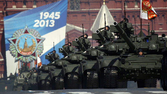 Russian servicemen salute from tanks during the Victory Parade on Moscow's Red Square May 9, 2013. (Reuters/Maxim Shemetov)