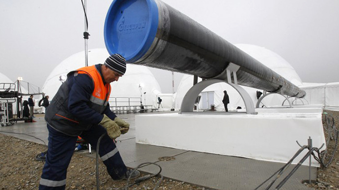 A worker checks wires in front a gas pipe line section before a ceremony to launch the construction of South Stream gas pipeline. (AFP Photo / Sergei Karpukhin)