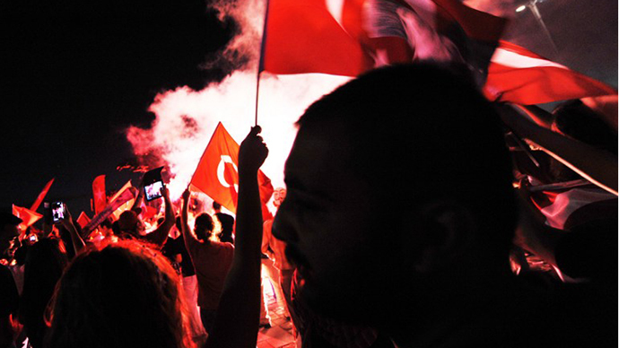 Turkish demonstrators burn flares during a protest on Gundogdu square in Izmir. (AFP Photo / Ozan Kose)