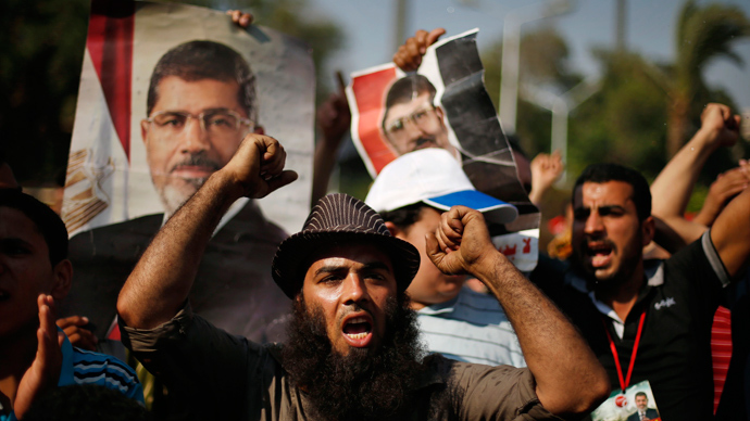 Supporters of deposed Egyptian President Mohamed Mursi shout slogans during a protest near Cairo University in Cairo July 6, 2013 (Reuters / Suhaib Salem)