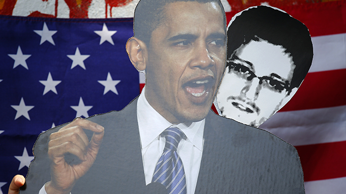 The portraits of U.S. President Obama and Snowden, a former contractor at the National Security Agency (NSA) (Reuters / Pawel Kopczynski)