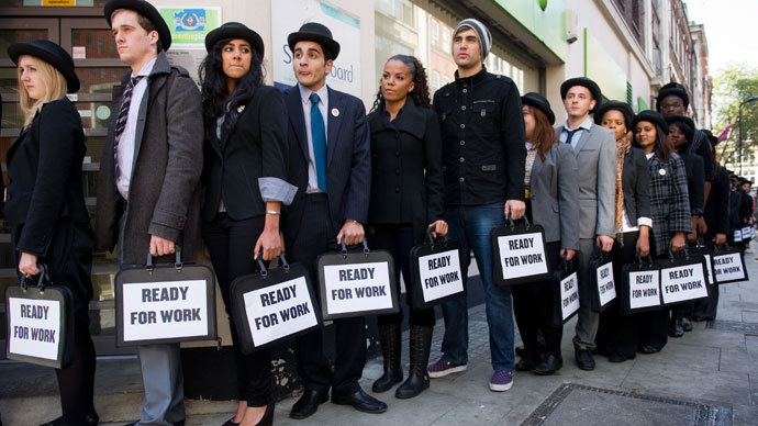 Unemployed young people as they stand in line outside a job centre in central London.(AFP Photo / Leon Neal)