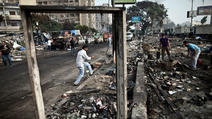 Egyptians search through the debris at Rabaa al-Adawiya square in Cairo on August 15, 2013, following a crackdown on the protest camps of supporters of the Egypt's ousted Islamist leader Mohamed Morsi the previous day.(AFP Photo / Mahmoud Khaled)