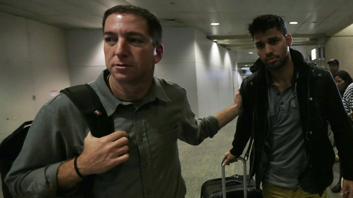 U.S. journalist Glenn Greenwald (L) walks with his partner David Miranda in Rio de Janeiro's International Airport August 19, 2013. (Reuters/Ricardo Moraes)