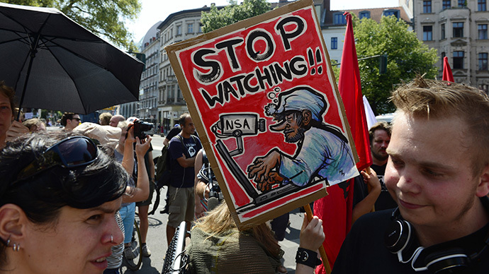 Demonstrators take part in a protest against the US National Security Agency (NSA) collecting German emails, online chats and phone calls and sharing some of it with the country's intelligence services in Berlin on July 27, 2013. (AFP Photo / John Macdougall)
