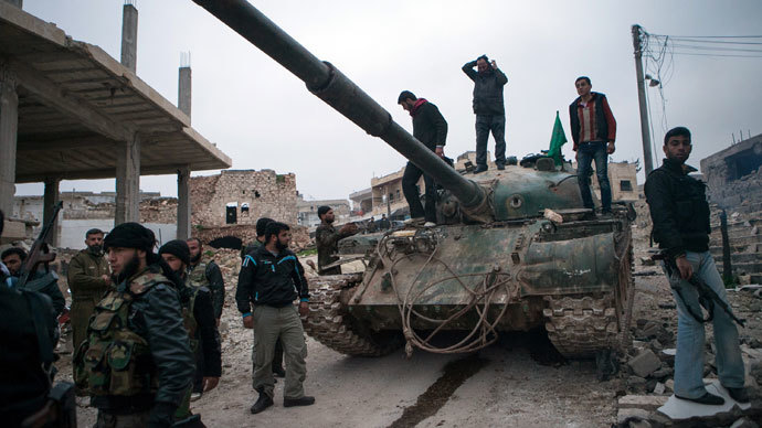 Syrian rebels gather around a T-72 tank.(AFP Photo / Daniel Leal-Olivas)