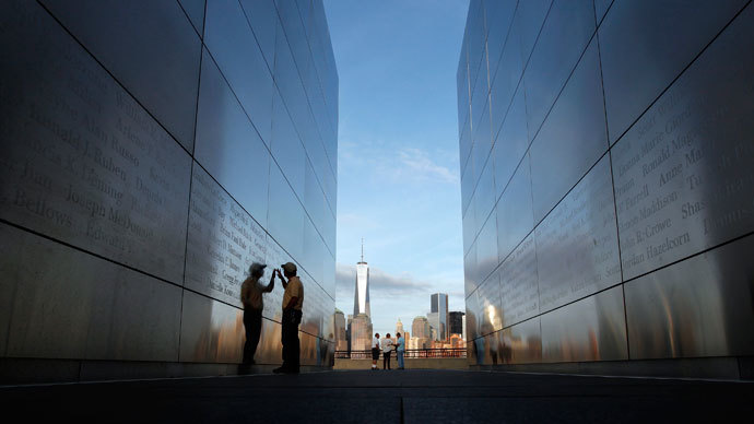 A man touches the wall at the 9-11 Empty Sky memorial across from New York's One World Trade Center at Liberty State Park in Jersey City, New Jersey, September 9, 2013.(Reuters / Gary Hershorn)