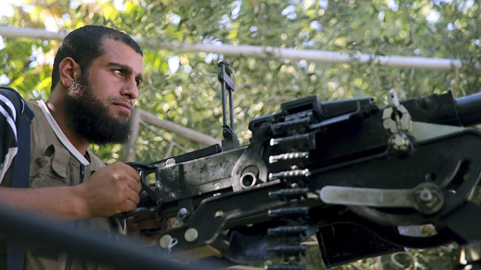 A Free Syrian Army fighter mans an anti-aircraft gun in al-Ghouta region in the eastern rural suburbs of Damascus, August 17, 2013. (Reuters/Mohamed Abdullah)
