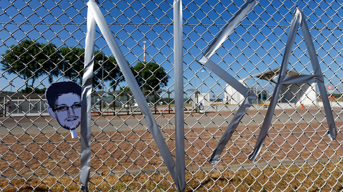 The letters "NSA" for National Security Agency and a mask of U.S. whistleblower Edward Snowden are taped on a fence of the "Dagger Complex", which is used by U.S. Army intelligence services, during a demonstration against the NSA and in support of Snowden in Griesheim, 20km (12.4 miles) south of Frankfurt, July 20, 2013.(Reuters / Kai Pfaffenbach)