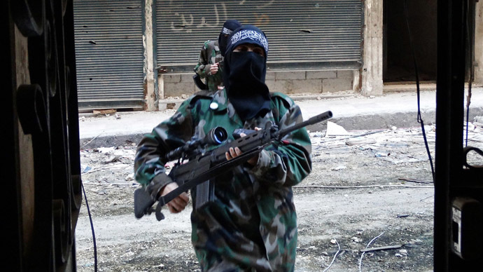 Masked female rebel fighters take part in a training session at the Salaheddin district of the war-battered northern Syrian city of Aleppo on October 2, 2013. (AFP Photo)