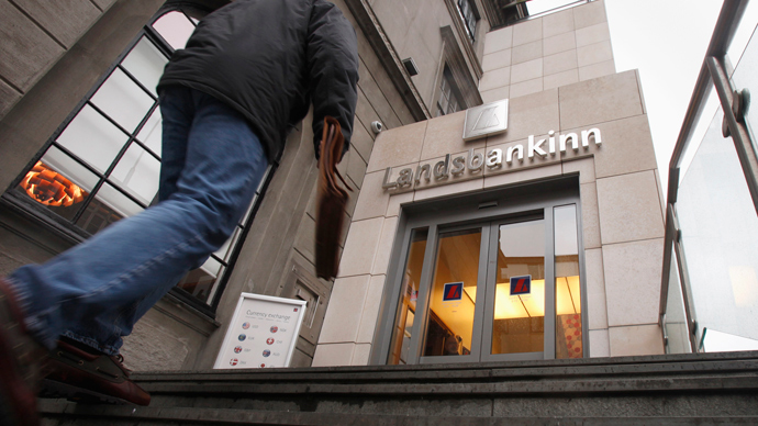A customer walks into the main branch of Landsbankinn Bank in downtown Reykjavik (Reuters / Bob Strong)