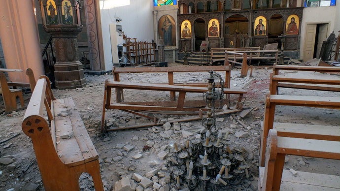 A fallen chandelier lies on debris in Im Al-Zinar church that was damaged during clashes between Syrian Rebels and the Syrian Regime in Bustan al Diwan, Homs July 23, 2012.(Reuters / Yazen Homsy)