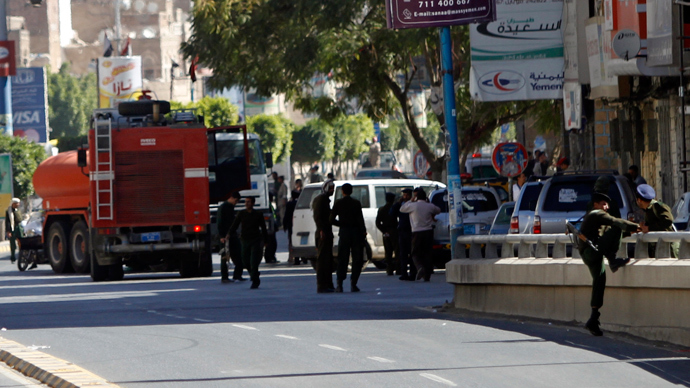 Firefighting vehicles drive to the Defence Ministry's compound after an attack in Sanaa December 5, 2013. (Reuters / Mohamed al-Sayaghi)