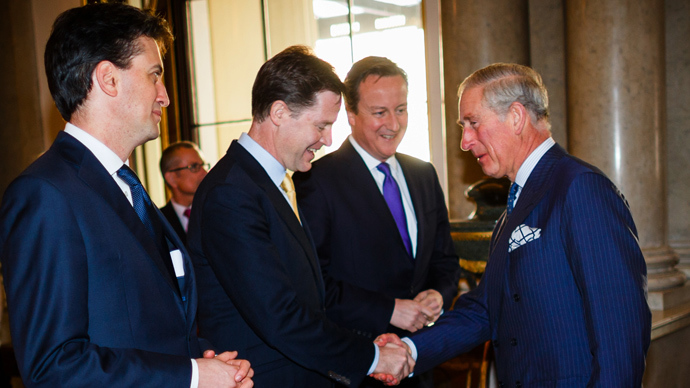 Britain's Deputy Prime Minister Nick Clegg (2-L), reaches to shake the hand of Prince Charles, The Prince of Wales (R) as Prime Minister David Cameron (2-R) and leader of the opposition Labour Party Ed Miliband (L) look on during the launch of a new initiative aimed at promoting social action entitled "Step Up To Serve" at Buckingham Palace in London (AFP Photo / Paul Rogers)