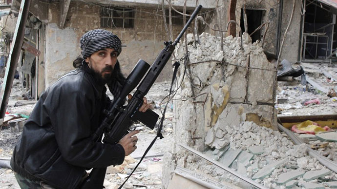 A rebel fighter from the Free Syrian Army holds a position with a Belgium made FAL rifle at a front line in the Salah al-Din neighbourhood of the northern Syrian city of Aleppo, on December 1, 2013. (AFP Photo / Mohammed Al-Khatieb)