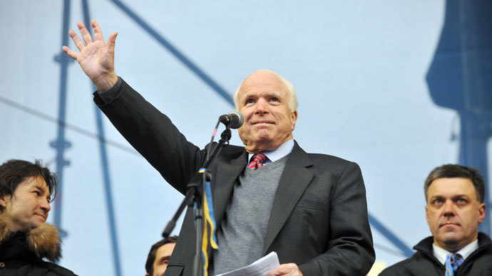 US Senator John McCain waves to protestors during a mass rally of the opposition Independence Square in Kiev on December 15, 2013.(AFP Photo / Genya Savilov)