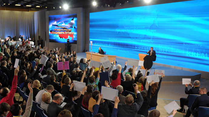Russian President Vladimir Putin, far center, answers journalists' questions at the annual big news conference in the World Trade Center, Krasnaya Presnya, Moscow, December 19, 2013. (RIA Novosti / Aleksey Nikolskyi)
