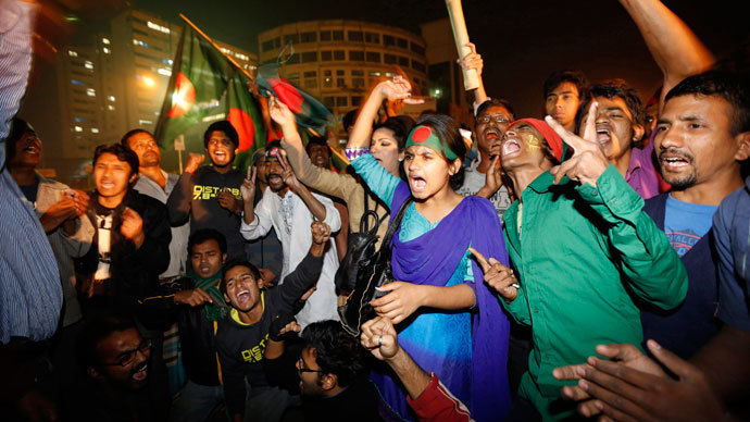 People celebrate after hearing the news of Bangladesh Jamaat-E-Islami leader Abdul Quader Mollah's execution in Dhaka .(Reuters / Andrew Biraj)
