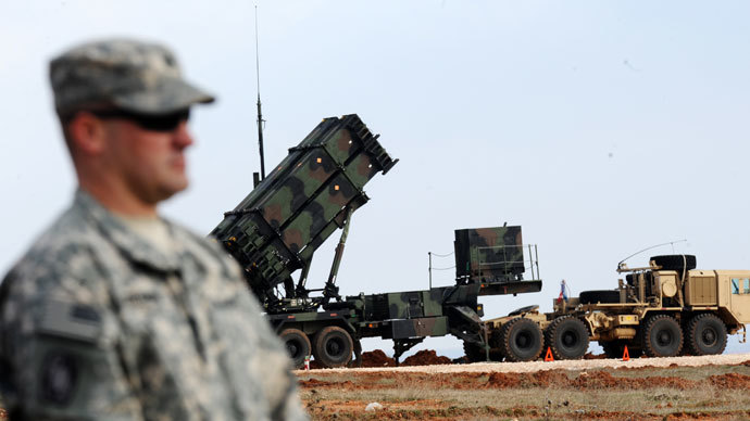 A US soldier stands in front of a Patriot missile system at a Turkish military base in Gaziantep on February 5, 2013.(AFP Photo / Bulent Kilic)