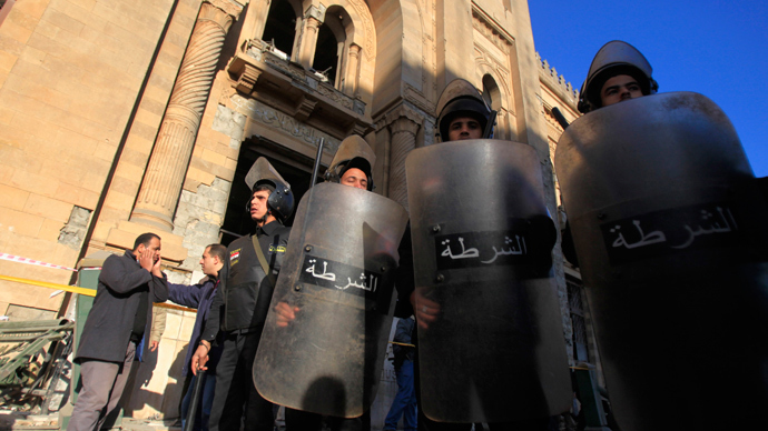 Riot police officers stand guard in front of the damaged Museum of Islamic Art building, after a bomb blast occurred at the nearby Cairo Security Directorate, which includes police and state security, in downtown Cairo, January 24, 2014. (Reuters / Amr Abdallah Dalsh)