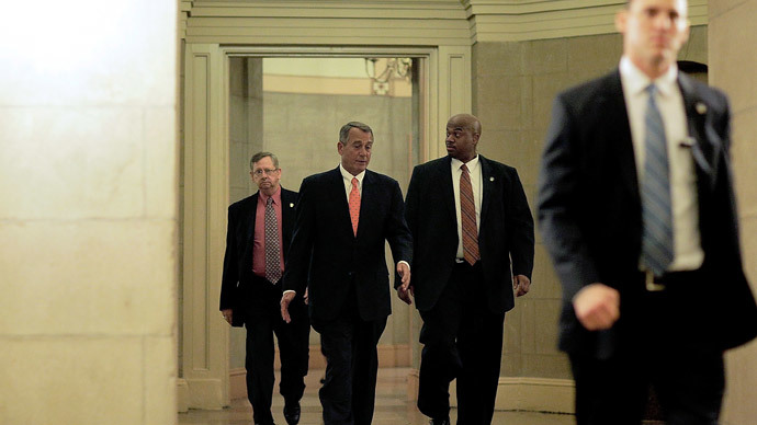 Speaker of the House U.S. Rep. John Boehner (2ndL) leaves from the Capitol building with his security detail on February 11, 2014 in Washington, DC.(AFP Photo / T.J. Kirkpatrick)