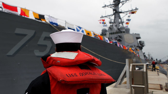 A sailor stands as the USS Donald Cook lays at dock in the southern port of Rota on February 11, 2014.(AFP Photo / Gogo Lobato )