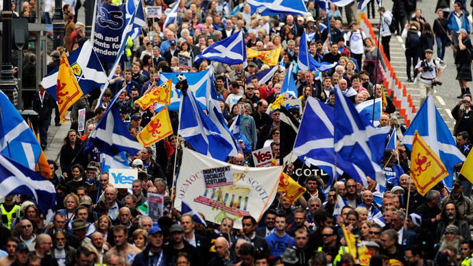 Pro-independence supporters march in Edinburgh on September 21, 2013 for a march and rally in support of a yes vote in the Scottish Referendum to be held on September 18, 2014.(AFP Photo / Andy Buchanan)