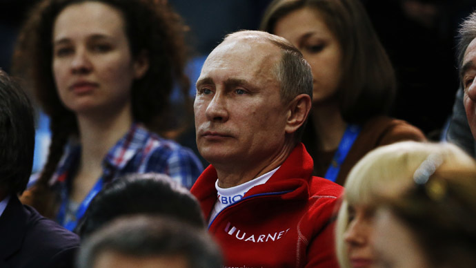 Russian President Vladimir Putin watches from the stands during the Team Ladies Free Skating Program at the Sochi 2014 Winter Olympics, February 9, 2014. (Reuters/Alexander Demianchuk)