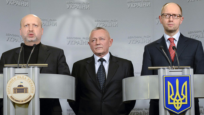 Ukraine's self-proclaimed President Aleksander Turchinov (L), Prime Minister Arseny Yatseniuk (R) and Defense Minister Igor Tenyukh (Reuters/Andrew Kravchenko)