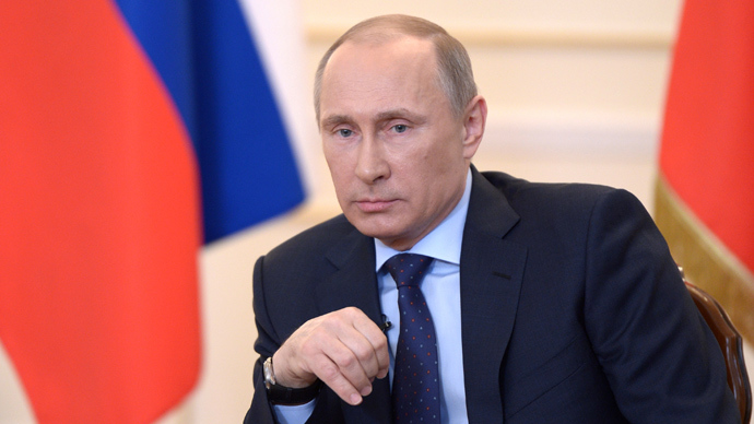 Russian President Vladimir Putin looks on during a press conference in his country residence of Novo-Ogaryova outside Moscow on March 4, 2014 (AFP Photo / Alexey Nikolsky)