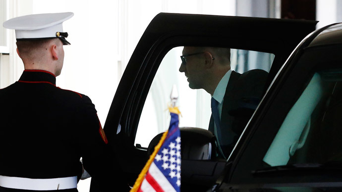 A U.S. Marine holds the door as Ukraine's Prime Minister Arseniy Yatseniuk arrives to meet with U.S. President Barack Obama at the White House in Washington March 12, 2014.(Reuters / Jonathan Ernst)