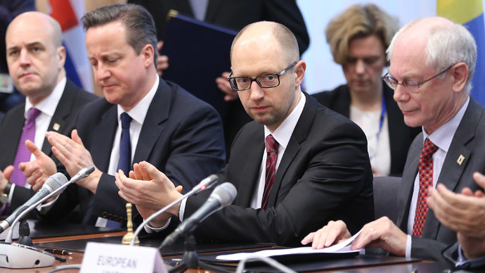 Ukrainian Prime Minister Arseniy Yatsenyuk (2nd-R) meets with EU leaders during the signing of the political provisions of the Association Agreement with Ukraine at the EU headquarters in Brussels on March 21, 2014 on the second day of a two-day European Council summit.(AFP Photo / Olivier Hoslet)