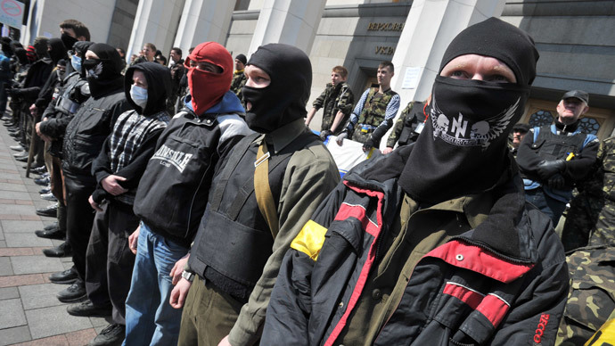Supporters of the right wing party Pravyi Sector (Right Sector) protest in front of the Ukrainian Parliament in Kiev on March 28, 2014.(AFP Photo / Genya Savilov)