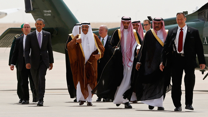 U.S. President Barack Obama (2nd L) is escorted from Marine One to board Air Force One as he departs Saudi Arabia to return to Washington, March 29, 2014 (Reuters / Kevin Lamarque)