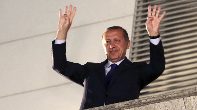 Turkey's Prime Minister Tayyip Erdogan greets his supporters in Ankara March 31, 2014. (Reuters)