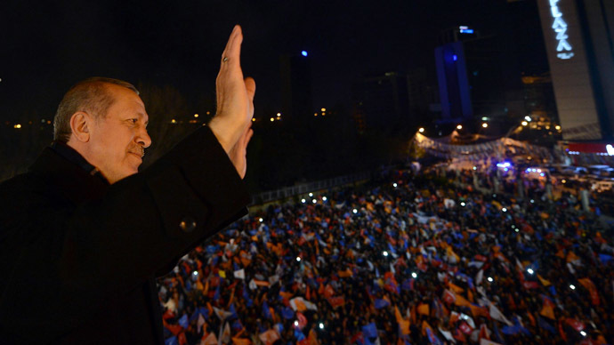A March 30, 2014 handout picture released by the Prime Minister Press Office shows Turkey's Prime Minister Tayyip Erdogan greets his supporters in Ankara on March 30, 2014. (AFP Photo)