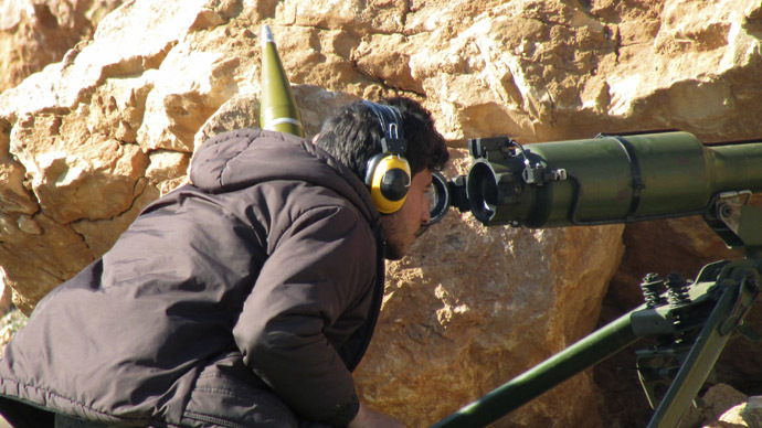 A Free Syrian Army fighter looks through a weapon in Sheikh Najjar in Aleppo March 20, 2014. (Reuters/Houssam Abo Dabak)